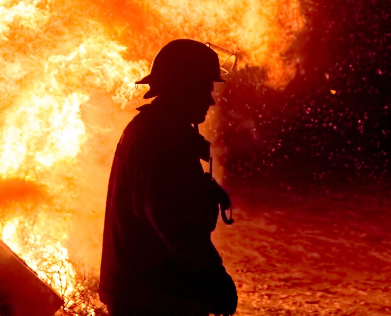 Fire Instructor with blazing fire in background